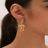 Elegant gold star and pearl pendant necklace displayed on a neck, showcasing trendy layered jewelry design.