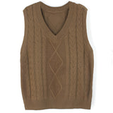 Elegant gray cable knit men's sleeveless wool sweater vest with a V-neck design, showcasing a classic knit pattern made from wool, displayed on a wooden surface.