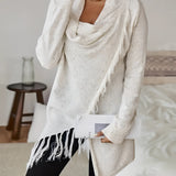 Elegant hooded cardigan in a chic winter fashion style for women, featuring a neutral beige and grey color palette, with a soft collar and long sleeves. The model is standing and showcasing the cardigan's fitted waist and cozy hood.