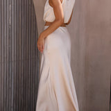 Elegant light grey silk halter neck top and satin maxi skirt set being worn, highlighting details such as the shoulder, neck, and waist areas in a formal, bridal party dress style under flash photography.