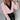Elegant light pink blouse for women featuring buttoned sleeves, shown in extra-large size (2XL).