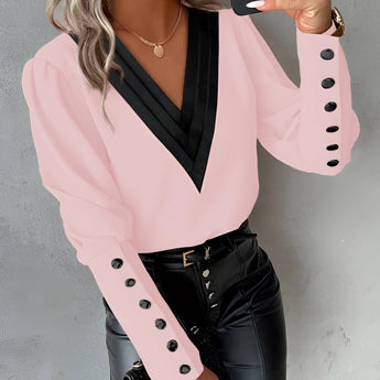 Elegant light pink blouse for women featuring buttoned sleeves, shown in extra-large size (2XL).