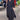 Elegant long black maxi dress with high collar and pockets, showcased in a stylish setting with subtle plant decor; features long sleeves and a flattering waistline suitable for formal events, available in Nero1 color in size 3XL.