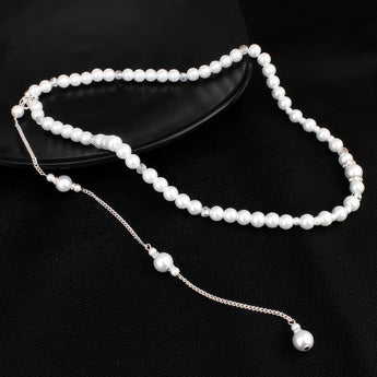 Elegant Long Pearl Bridal Back-Drop Necklace with silver chain and pearl accents displayed on a monochrome background.