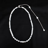 Elegant long pearl bridal back-drop necklace with silver accents, designed for weddings and special events, displayed on a white background.