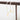 Elegant minimalist pearl choker with a gold moon pendant displayed on a wooden surface.