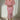 Elegant pink floral maxi dress with long sleeves, featuring a fitted waist and stylish design, modeled by a fashion model.