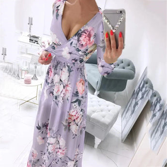 Elegant pink floral maxi dress with deep V neckline and long sleeves, featuring a high slit. The dress is in a light violet color, suitable for a size 2XL.