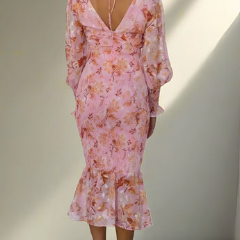 Elegant pink floral maxi dress with long sleeves, featuring a sheath silhouette and designed for autumn evenings.