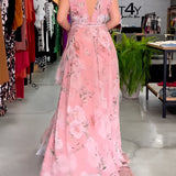 Elegant pink floral sleeveless V-neck maxi dress featuring a fitted waist, perfect for spring weddings.