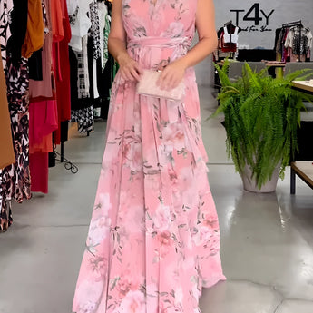 Elegant pink floral sleeveless V-neck maxi dress with a fitted waist, ideal for spring weddings, featuring delicate floral patterns.