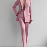 Elegant pink women's suit consisting of a tailored blazer with a structured collar and matching trousers, showcased in a 2XL size.
