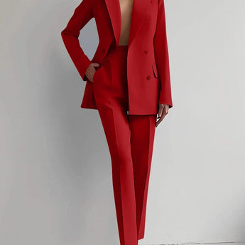 Elegant red women's suit featuring a tailored blazer and trouser set in size 2XL, showcasing fashion-forward design with a structured shoulder, collared neckline, and long sleeves.