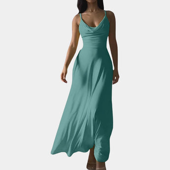 Elegant plus size emerald green maxi dress with a cowl neck and sleeveless design, showcasing a flowing silhouette.