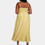 Elegant plus size green maxi dress featuring a cowl neck and sleeveless design, showcasing a flowing silhouette.