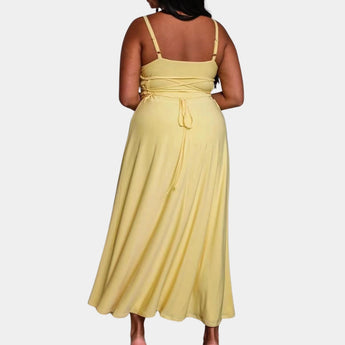 Elegant plus size green maxi dress featuring a cowl neck and sleeveless design, showcasing a flowing silhouette.
