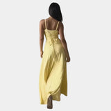 Elegant plus size green maxi dress with a cowl neck and sleeveless design, perfect for a fashionable and sophisticated look.