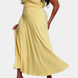 Elegant plus size green maxi dress featuring a cowl neck and sleeveless design, with a flowing silhouette that highlights the waist, perfect for formal occasions.