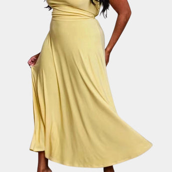 Elegant plus size green maxi dress featuring a cowl neck and sleeveless design, with a flowing silhouette that highlights the waist, perfect for formal occasions.
