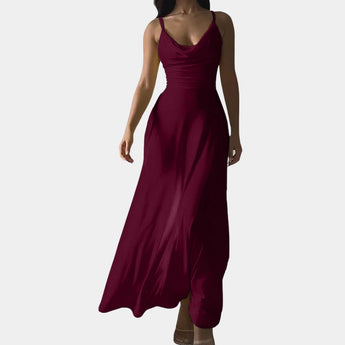 Elegant red plus-size maxi dress with cowl neck and sleeveless design, featuring a fitted waist and flowing gown suitable for formal occasions.