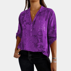 Elegant purple silk blouse with a sequin pocket, featuring a dress shirt style with a collar and long sleeves, suitable for luxury casual wear.