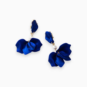 Elegant royal blue floral earrings with pearl accents, featuring intricate flower and petal designs, perfect for wedding jewelry.