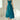 Elegant teal midi dress in a fit and flare style, featuring a sleeveless design and a flattering waist, suitable for formal events. The dress is displayed in a vibrant turquoise blue color, highlighting its sophisticated and graceful look.
