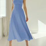 Elegant teal midi dress in a sleeveless fit and flare style, suitable for formal events, displayed hanging against a neutral background.