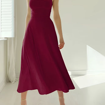 Elegant teal midi dress in a sleeveless, fit and flare style, ideal for formal events, showcasing the shoulder and arm details against a neutral background.