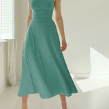 Elegant teal midi dress in a sleeveless fit and flare design, suitable for formal events, featuring a fitted bodice, flared skirt, and a smooth neckline for an elegant silhouette.
