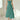 Elegant sleeveless teal midi dress in a fit and flare design, featuring a flattering waistline and a graceful neckline, ideal for formal events such as a bridal party; shown in an intense sage green color, size 3XL.