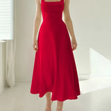 Elegant sleeveless fit and flare midi dress in a rich red color, designed for formal events, featuring a defined waist and flowing skirt, suitable for plus-size individuals.