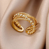 Elegant textured gold bead ring displayed on a model's finger, highlighting premium designer craftsmanship.