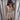 Elegant V-neck sleeveless romper in beige, modeled in XXL size, showcasing the front design with focus on the neckline and waist.