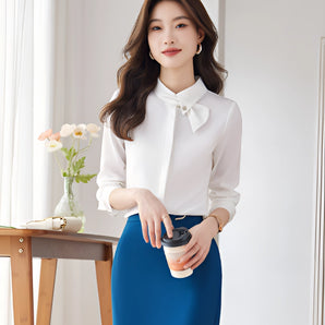 Elegant white bow tie blouse in size 2XL featuring a chic design suitable for office and formal settings, showcasing details such as a dress shirt style with a sophisticated bow at the neck, long sleeves, and a flattering fit around the waist.