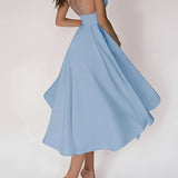 Elegant white bridal gown featuring a plunging neckline and spaghetti straps, styled in light blue, size 2XL, displayed on a mannequin, showcasing the gown's flowing silhouette and intricate detailing.