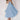 Elegant white bridal gown featuring a plunging neckline and spaghetti straps, styled in light blue, size 2XL, displayed on a mannequin, showcasing the gown's flowing silhouette and intricate detailing.
