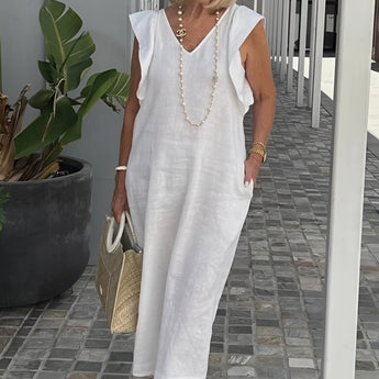 Elegant white linen V-neck summer dress in size 3XL, styled with a pearl necklace.