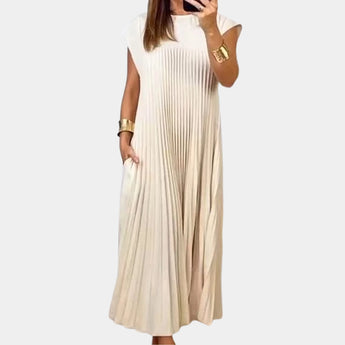 Elegant white midi pleated dress with short sleeves and a fitted waist, perfect for a summer casual chic look, modeled by a standing figure.
