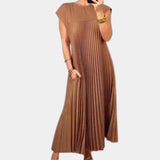 Elegant white midi pleated dress with short sleeves and a fitted waist, perfect for summer casual chic occasions.