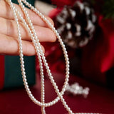 Elegant white pearl choker for bridal wear, featuring natural pearls and designed for a luxurious look around the neck.