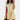 Alt text: Woman wearing a yellow XL mini dress with ruffle hem, featuring short sleeves and a casual summer style.