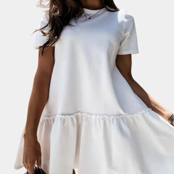 
A white ruffle hem mini dress designed for women, featuring short sleeves and a round neck. The dress is styled for casual summer wear and is shown in an extra-large size.