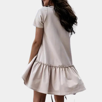 Elegant white ruffle hem mini dress with short sleeves, perfect for summer casual wear, modeled by a woman showcasing the dress's fitted waist and flowing knee-length skirt.