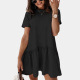 Elegant white ruffle hem mini dress with sleeveless design, featuring a fitted bodice, flared hem, and knee-length, worn by a smiling woman accessorized with a watch.