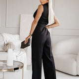 Elegant white sleeveless V-neck belted formal jumpsuit for women, showcasing a stylish and comfortable design with emphasis on the neck, waist, and thigh areas.