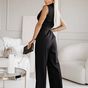 Elegant white sleeveless V-neck belted formal jumpsuit for women, showcasing a stylish and comfortable design with emphasis on the neck, waist, and thigh areas.