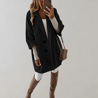 Elegant women's oversized beige wool coat with a high-collar design, displayed in a black color variant, size 2XL. The coat features a classic tartan pattern and is modeled by a person showcasing the shoulder and neck areas, emphasizing the coat's stylish and practical outerwear qualities for winter.