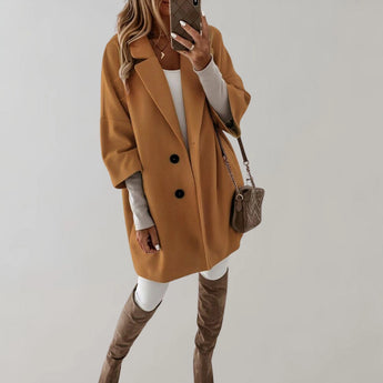 
A high-collar, oversized wool coat for women in a beige khaki color, featuring long sleeves and a tailored waist, designed for winter wear.
