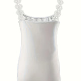 Elegant women's black ruffled sleeveless tank top displayed on a mannequin, showcasing its formal and chic design with a focus on the delicate ruffles and smooth fabric.